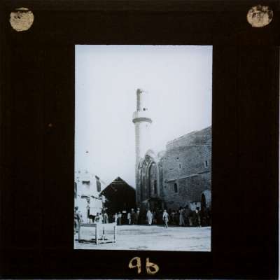 Lantern Slide: Crowd of people approaching mosque with minaret