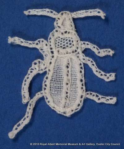 Honiton (East Devon) lace sprig in the design of an insect
