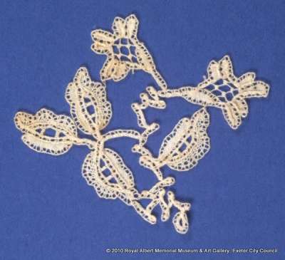 Honiton (East Devon) lace sprig with design of rose and buds