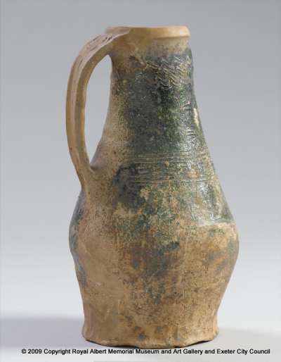 earthenware jug with slip, sgraffito combing and copper-mottled glaze