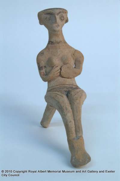 figurine of a seated woman