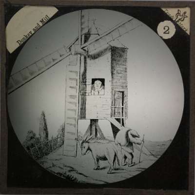 Lantern Slide: He fastens his donkey to the sail of the mill