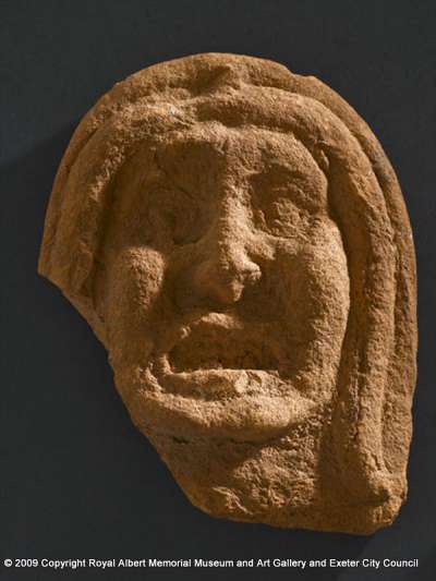 antefix tile in the form of a female human face