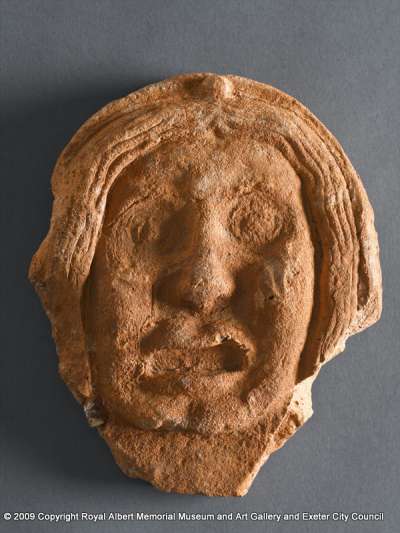 antefix tile in the form of a female human face