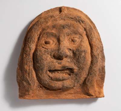 antefix in form of face