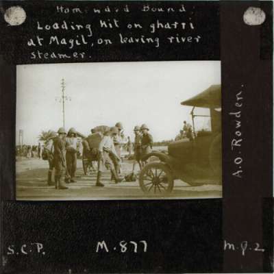 Lantern Slide: Homeward Bound: Loading kit on gharri at Magil, on leaving river steamer