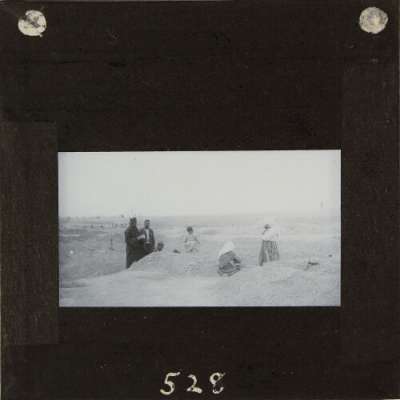 Lantern Slide: Group of local people with religious man