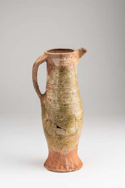 jug with slip and green glaze, rilled decoration
