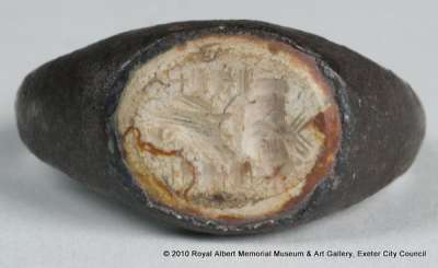 intaglio ringstone depicting an eagle, altar, military standards and clasped hands